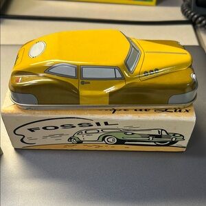Fossil Yellow and Green Car Tin